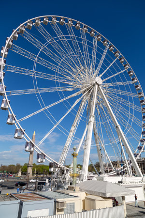 Paris, France, March 27 2017: Ferris wheel Roue de Paris at Place de la Concorde. Sunny day. Travel to famous landmarksのeditorial素材