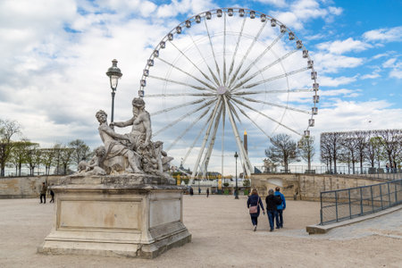 Paris, France, March 28 2017: Ferris wheel - view from Jardin des Tuileries. The giant Ferris wheel Grande Roue is set up on Place de la Concorde, between Obelisque and the Jardin des Tuileries.のeditorial素材