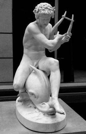 Paris, France, March 28 2017: Ancient statue of a poet Arion with a dolphin. In Musee dOrsay, museum in Paris, on the left bank of the Seineのeditorial素材