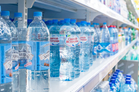 Moscow, Russia - March 12, 2018: Mineral and pure water bottles display on the shelf in supermarketのeditorial素材