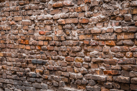Old messy brick wall texture background exterior