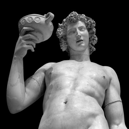 Dionysus Bacchus Wine statue portrait on blackの写真素材