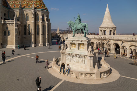 Budapest, Hungary, March 22 2018: Mounted statue of Saint Stephen I, aka Szent Istvan kiraly - the first king of Hungary at typical white rounded tower of Fishermans Bastion in Buda Castle in Budapesのeditorial素材
