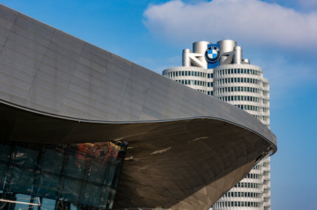 Munich, Germany - March 10, 2016: BMW four-cylinder tower Munich landmark which serves as world headquarters for Bavarian automaker. Stock photo with elements of designs Museum and Welt worldのeditorial素材