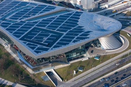 Munich, Germany - March 10, 2016: BMW four-cylinder tower Munich landmark which serves as world headquarters for Bavarian automaker. Stock photo with elements of designs Museum and Welt worldのeditorial素材