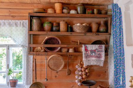 Traditional Russian cottage with oven and crockery. Interior of a peasant hut