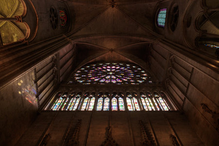 Paris, France, March 27 2017: Famous Notre Dame cathedral stained glass. UNESCO World Heritage Site....
