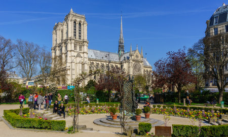 Paris, France, March 27 2017: Tourists visiting the Cathedrale Notre Dame de Paris is a most famous...