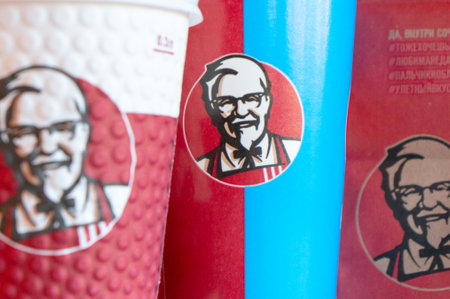 Moscow, Russia, October 11, 2018 : Coffee in paper cups with KFC logo on the table at KFC