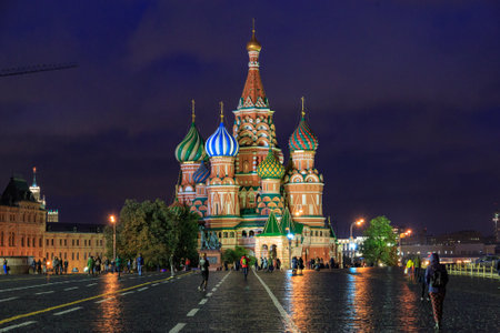 Moscow, Russia. October 4, 2018: St. Basils Church in Red Square, Moscow at Night with crowds walking around. View as seen from the State Historical Museumのeditorial素材