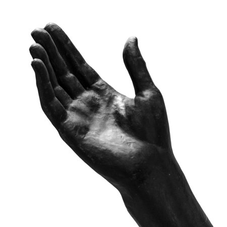 Black stone statue hand on white backgroundの写真素材