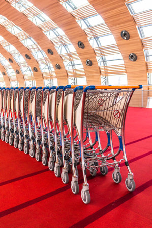Paris, France, April 1, 2017: luggage carts at modern airport
