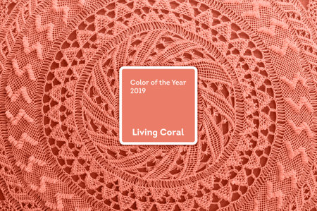 Living Coral color of the Year 2019. Handmade lace round background with coral in trendy colorの写真素材