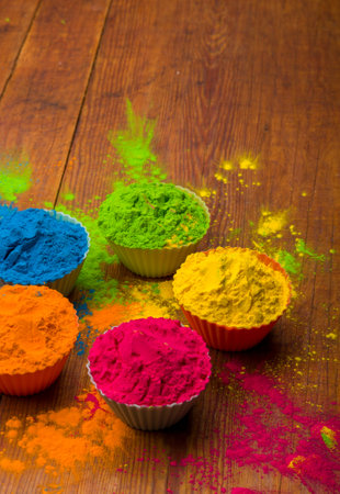 Holi color powder. Organic Gulal colours in bowl for Holi festival, Hindu tradition festive