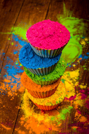 Holi color powder. Organic Gulal colours in bowl for Holi festival, Hindu tradition festive
