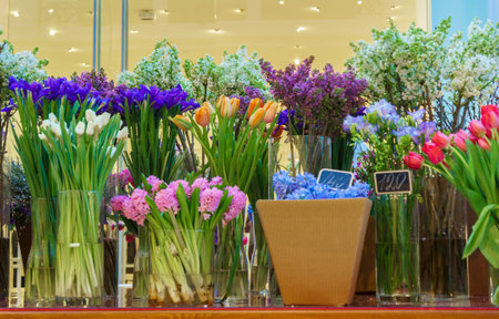 Flower shop concept. Close-up beautiful lovely bouquet of mixed flowers on wooden table. Flowers composition. Abstract background of flowers.の写真素材