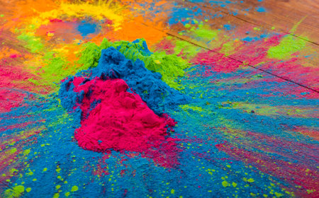 Abstract colorful Happy Holi background. Color vibrant powder on wood. Dust colored splash texture. Flat lay holi paint decoration.の写真素材