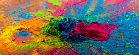 Abstract colorful Happy Holi background. Color vibrant powder on wood. Dust colored splash texture. Flat lay holi paint decoration.の写真素材