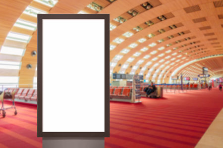 mock up of vertical blank advertising billboard or light box showcase with people waiting at airport, copy space for your text message or media content, advertisement, commercial marketing conceptの写真素材
