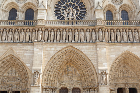 Paris, France, March 27 2017: Detail of the Notre Dame Cathedral in Paris. Statues on the facade of Notre Dame Cathedralのeditorial素材