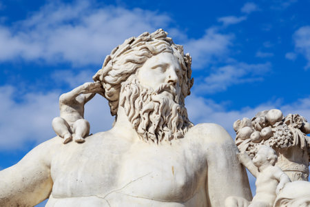 Paris, France - March 28, 2017: A statue of the Colossus Nile in the Jardin des Tuileries in Paris against a bright blue sky with white clouds, Franceのeditorial素材