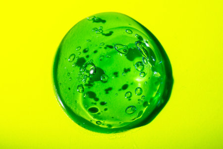 Cream gel transparent cosmetic sample texture with bubbles isolated on white background. Cosmetic cream transparent gel serum texture with micro bubble on white background beauty conceptの写真素材