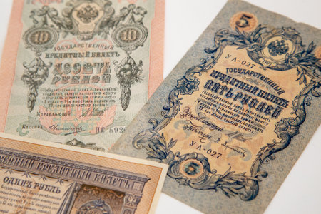 Moscow, Russia, 23 October 2019: Old russian banknote, 5 rubles and 10 rubles, circa 1909. Tzar Russia - bill 1909: A bill printed National Emblem - two-headed eagle. Old Russian moneyのeditorial素材