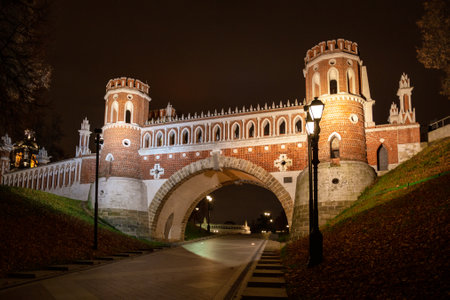 Moscow, Russia, 23 October 2019: Tower of Figured bridge in Tsaritsyno park in Moscow with light decorations at night. Bridge in the park near the Tsaritsyno palace on the Sunsetのeditorial素材