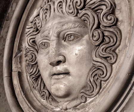 Medusa face sculpture. Head portrait of MedusaIn Greek mythology Medusa was a monster, a Gorgon, a winged human female with a hideous face and living venomous snakes in place of hairの写真素材
