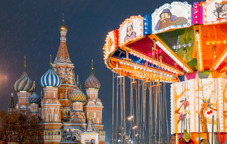 Moscow, Russia, 05 December 2017: Christmas in Moscow. Bright Christmas carousel in the capital of Russia. Christmas market on red square. Kremlin. St. Basilのeditorial素材