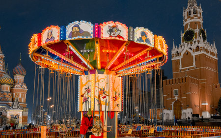Moscow, Russia, 05 December 2017: Christmas in Moscow. Bright Christmas carousel in the capital of Russia. Christmas market on red square. Kremlin. St. Basilのeditorial素材