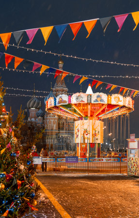 Moscow, Russia, 05 December 2017: Christmas in Moscow. Bright Christmas carousel in the capital of Russia. Christmas market on red square. Kremlin. St. Basilのeditorial素材