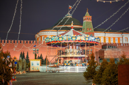 Moscow, Russia - November 27, 2019: Christmas in Moscow. Bright Christmas carousel in the capital of Russia. Christmas market on red square. Kremlin. St. Basilのeditorial素材