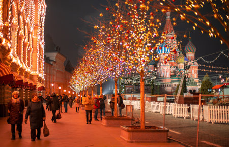 Moscow, Russia - November 27, 2019: New year entertainment on red square. Kremlin. St.Basil Cathedral. Red square is decorated for Christmas. Winter trip to the capital of the Russiaのeditorial素材