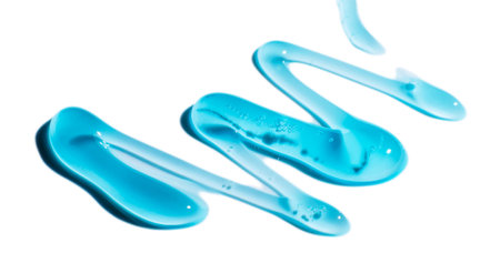 Squeezed cosmetic clear cream gel texture Iisolated on white background. Close up photo of transparent drop of skin care product. High Quality transparent gel serum with bubbles on white backgroundの写真素材