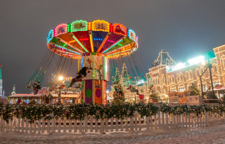 Moscow, Russia, 28 january 2020: Celebration carousel of the New Year and Christmas on the Red Square in the center of Moscow. Holiday fair and amusement park near the Kremlinのeditorial素材