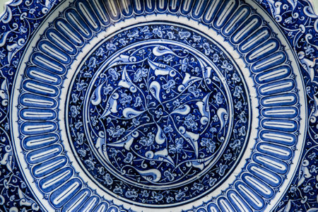 Texture of ceramic tiles in oriental East style. Turkish ceramic tiles lined on the wall. Old azulejo pattern floral ornament on floor. Ottoman traditional art. Moroccan portuguese mosaic backgroundの写真素材