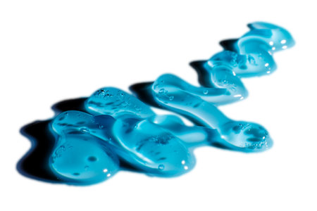 Water blue gel balls. Polymer gel. Silica gel. Balls of blue hydrogel. Crystal liquid ball with reflection. Texture background. Close up macro. Soapsuds background with air bubblesの写真素材