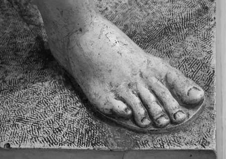 Detail of a marble statue, depicting the footの写真素材