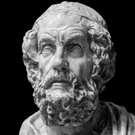 Head and shoulders detail of the ancient man with beard sculpture. Antique face with whiskers statue isolated on black backgroundの写真素材