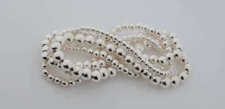 Closeup Pile of Pearls Isolated on White Background