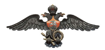 Russian double-headed coat of arms eagle, made from triggers, spherical bullets, and lock planks from flintlocks isolated on white backgroundの写真素材