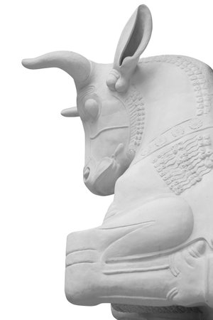 Stone statue. Bull isolated on a white background with clipping pathの写真素材