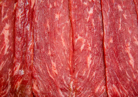 Fresh meat background. Raw uncooked red beef meat texture. Closeup patternの写真素材