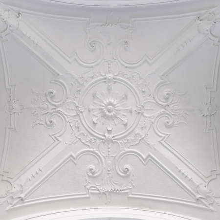 Decorative item ceiling socket made of white plaster. Relief stucco interiorの写真素材