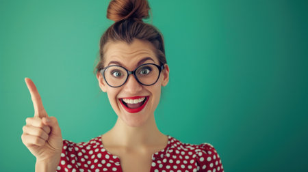 Photo of good mood funny cute clever woman with bob hairstyle raise finger up good idea isolated on green color background.の素材