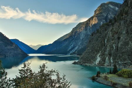 Blue water Lilooet lake in British Columbia in Canada, peaceful scenery, on the bank of blue lake in mountaines, candaian beatiful nature, road trip across Canada, alpine natureの写真素材