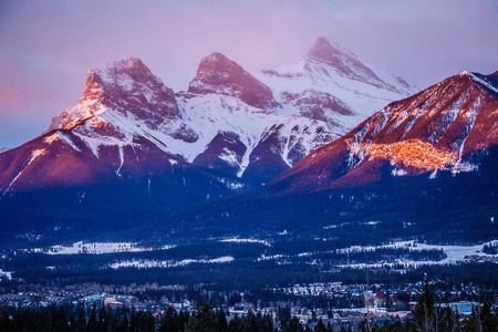Three sisters mountain view at sunrise time in Canmore town, Canadaの写真素材