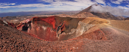 Panoramatic view of unique volcanic landscape of Tongariro NP in New Zealand, Tongariro crossing track around red crater of Tongariro volcano, Mt. Ngauruhoe in the clouds, the best national park of New Zealandの写真素材
