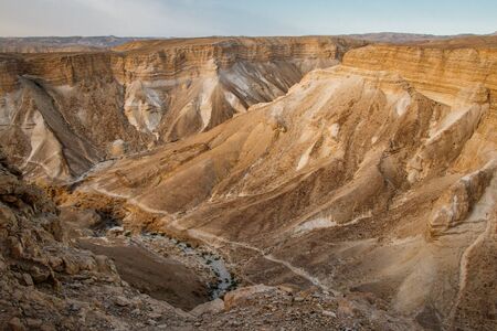 Dry canyons of Israeli desert from the top of Masada fortress, canyonlands of Israel country, viwe down from national monunet of israeli Masadaの写真素材